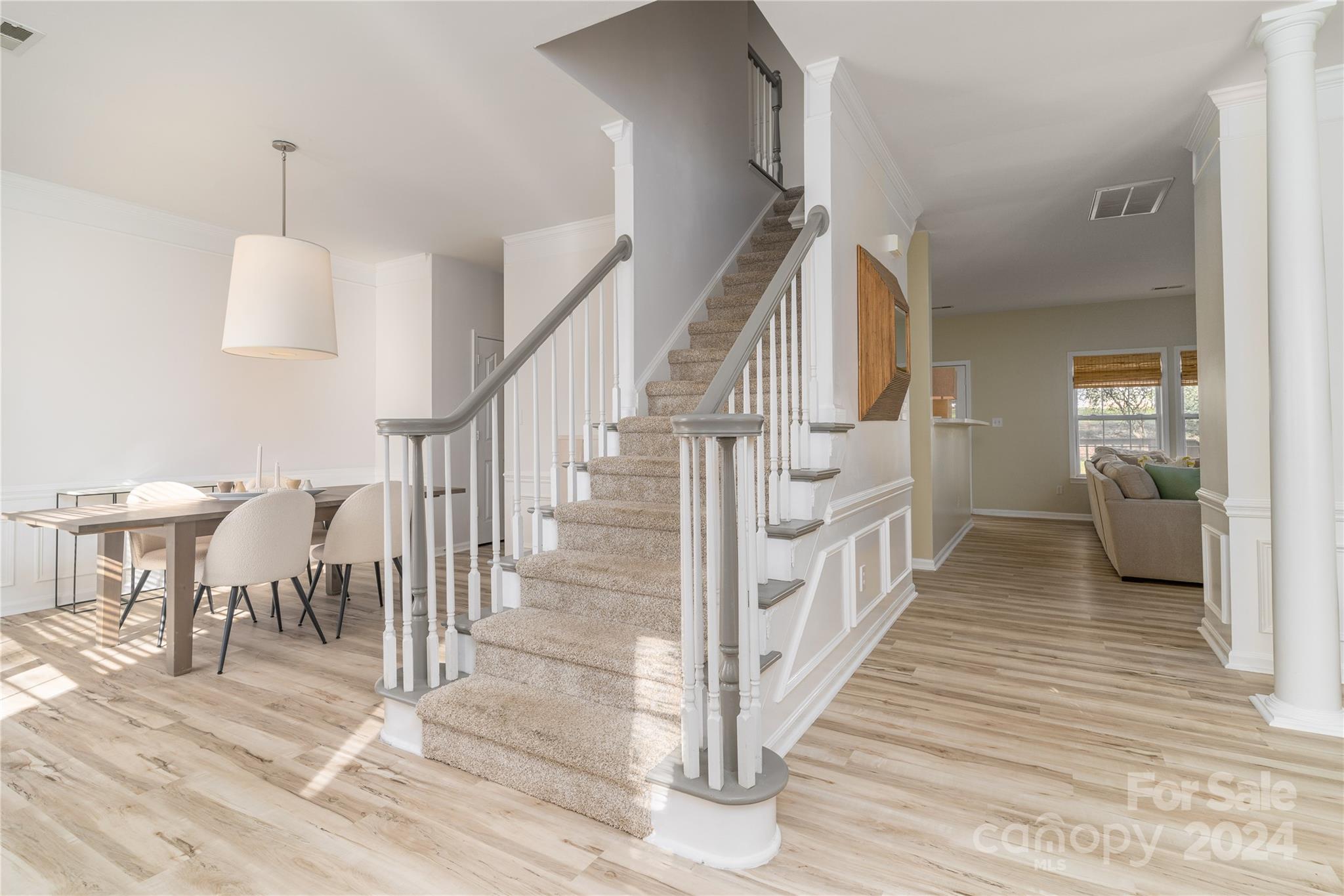 9427 Culcairn Road Huntersville, NC 28078 - Photo 20 of 39 a view of a hallway with wooden floor and staircase