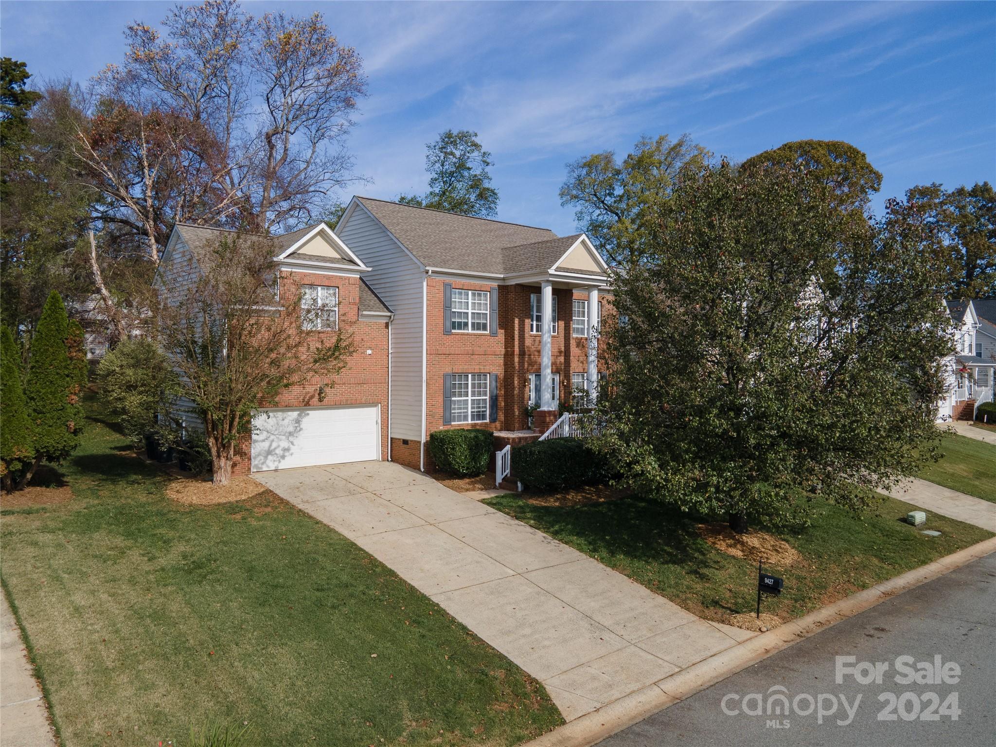 9427 Culcairn Road Huntersville, NC 28078 - Photo 2 of 39 a front view of a house with garden