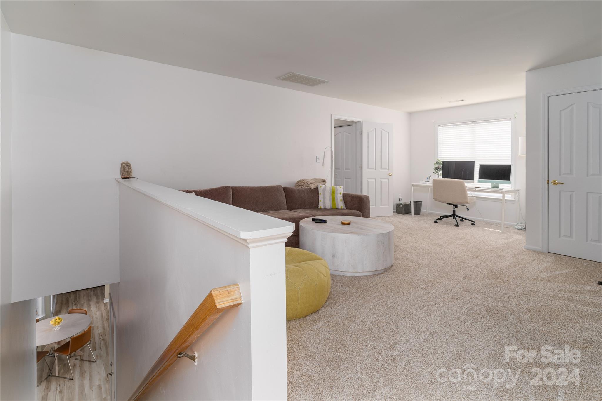 9427 Culcairn Road Huntersville, NC 28078 - Photo 21 of 39 a living room with furniture and a couch