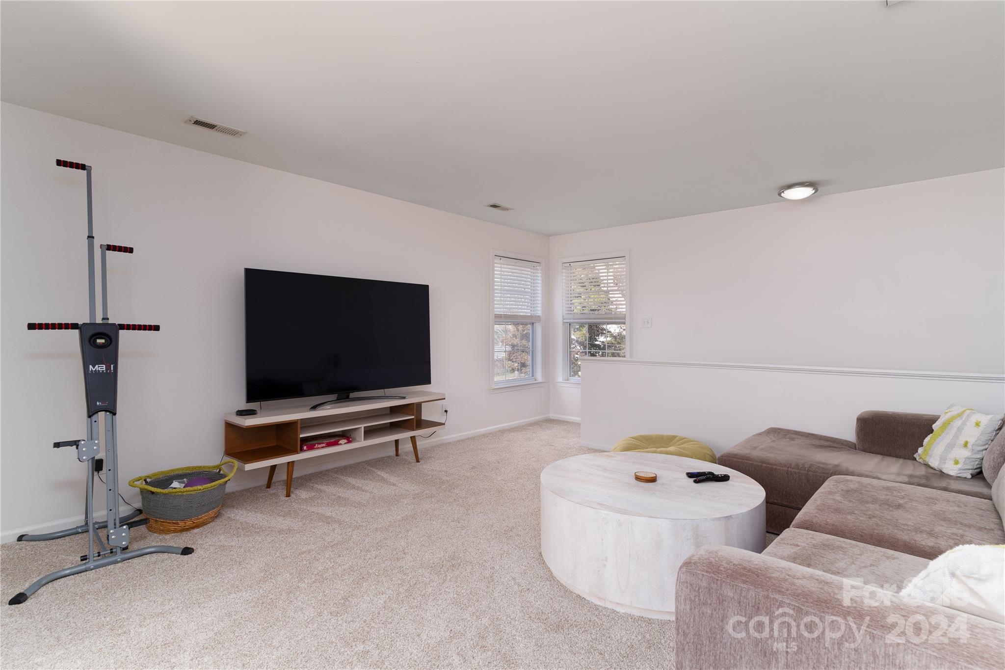 9427 Culcairn Road Huntersville, NC 28078 - Photo 22 of 39 a living room with furniture and a flat screen tv