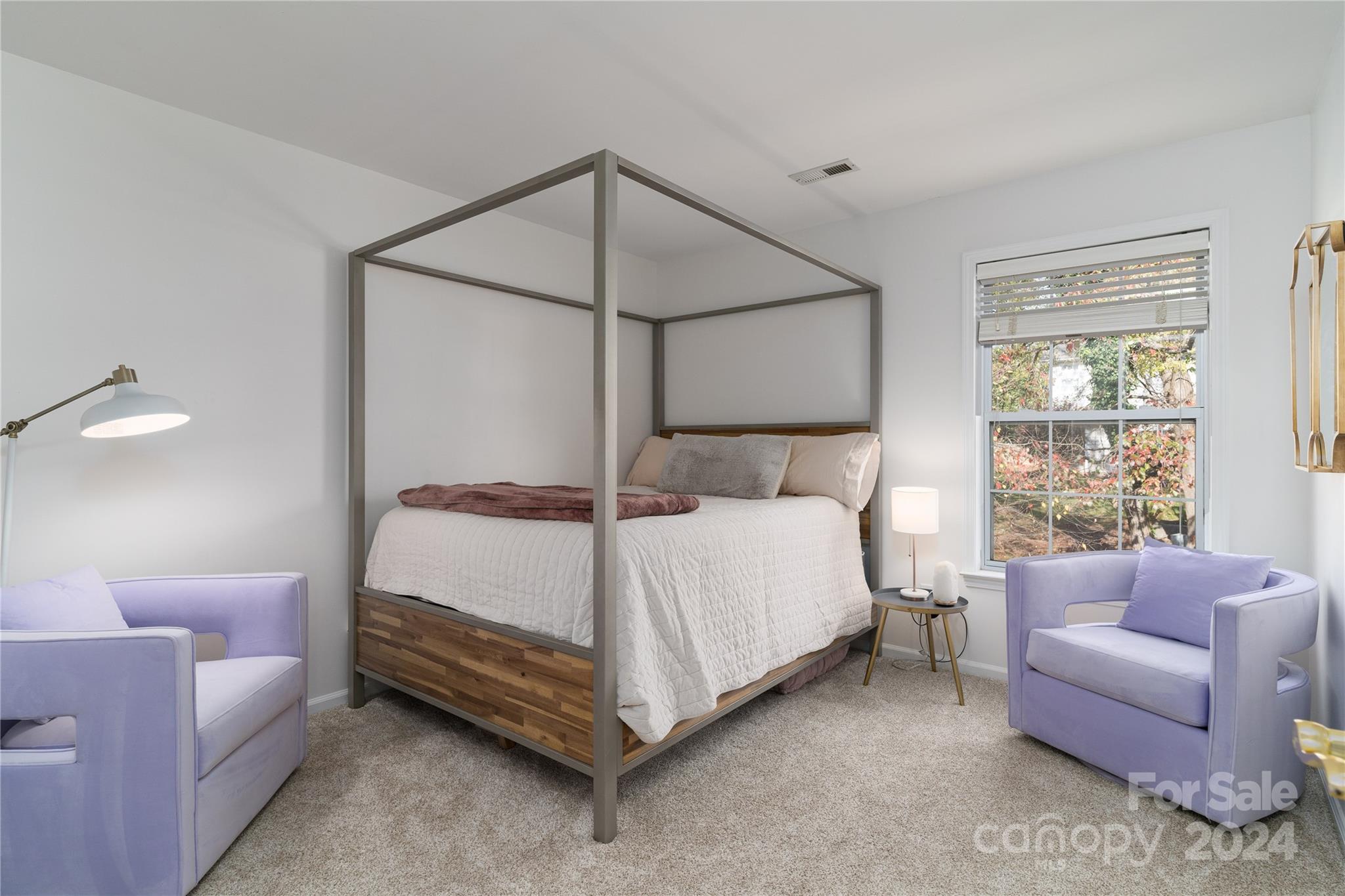 9427 Culcairn Road Huntersville, NC 28078 - Photo 27 of 39 a bedroom with a bed couch and window