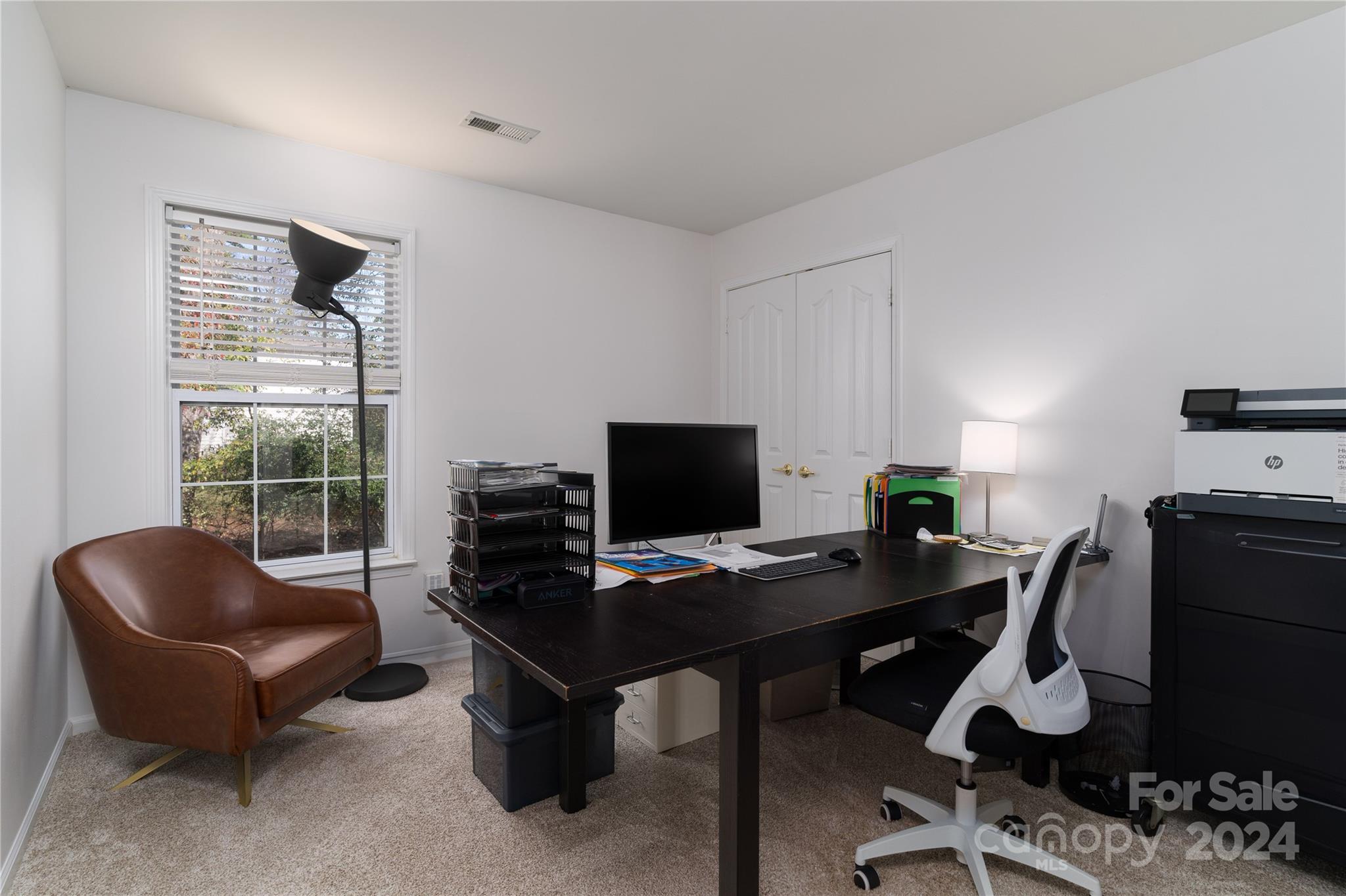 9427 Culcairn Road Huntersville, NC 28078 - Photo 28 of 39 a view of a workspace with furniture and a window