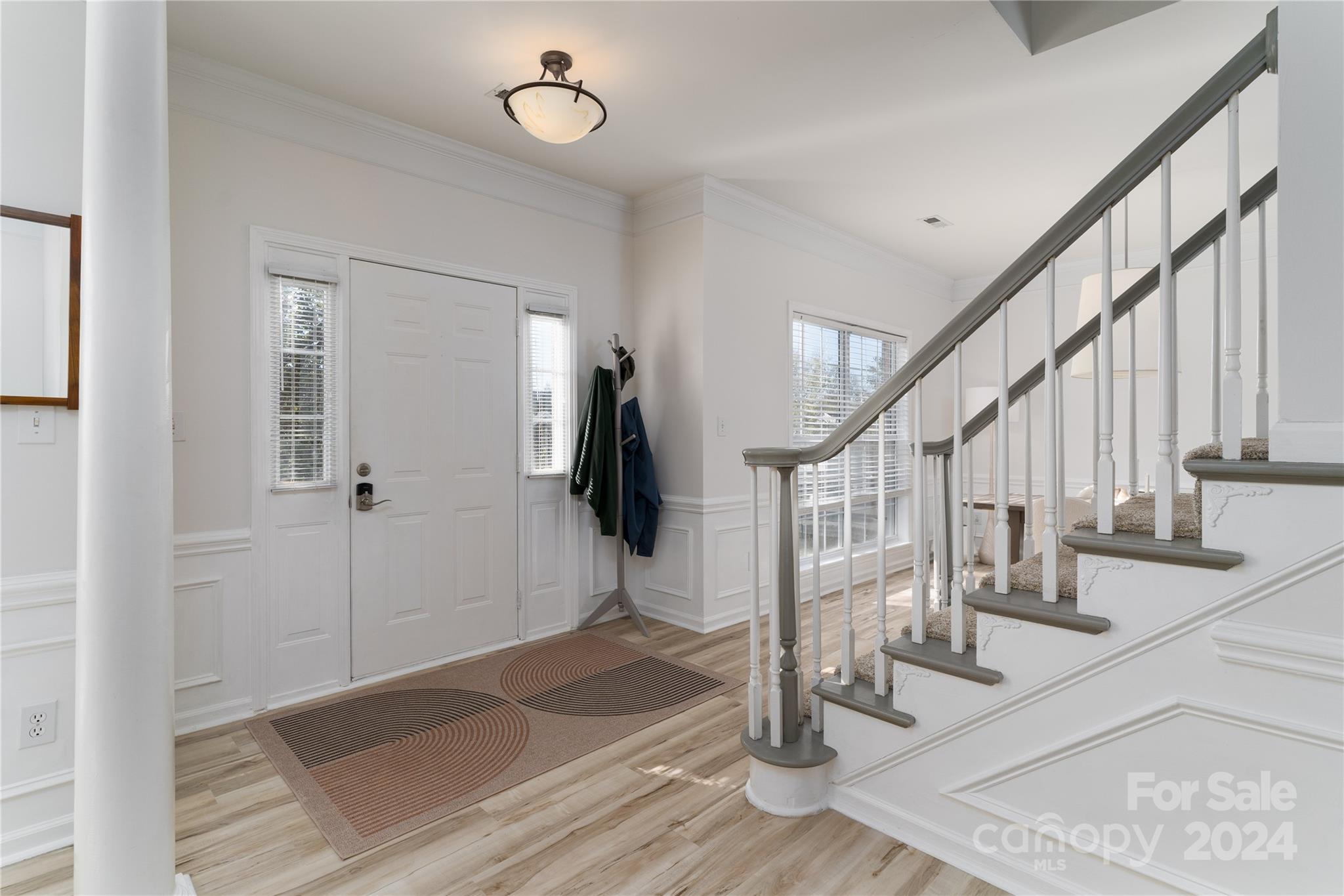 9427 Culcairn Road Huntersville, NC 28078 - Photo 6 of 39 a view of entryway and hall with wooden floor