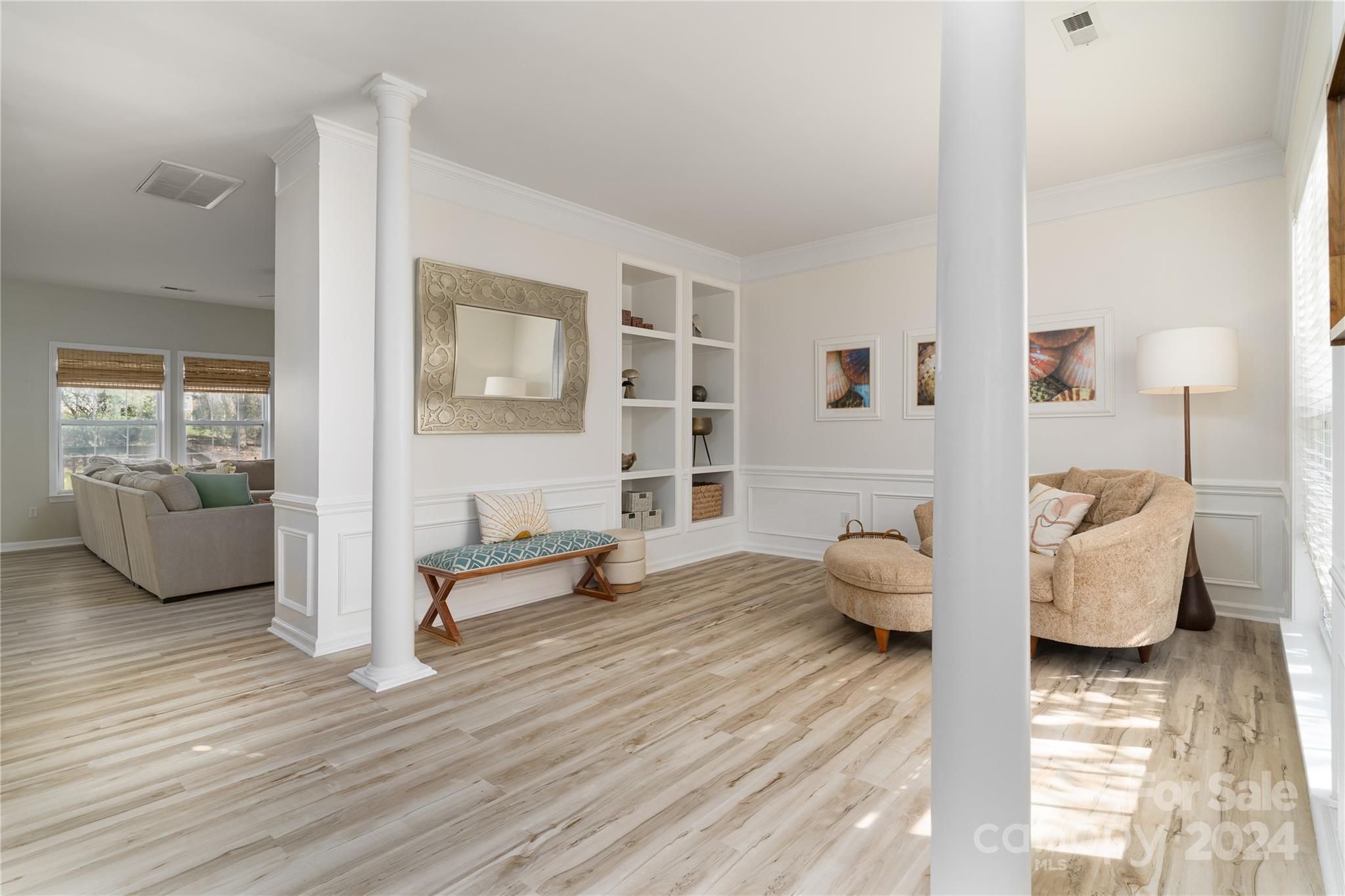 9427 Culcairn Road Huntersville, NC 28078 - Photo 7 of 39 a living room with furniture and wooden floor