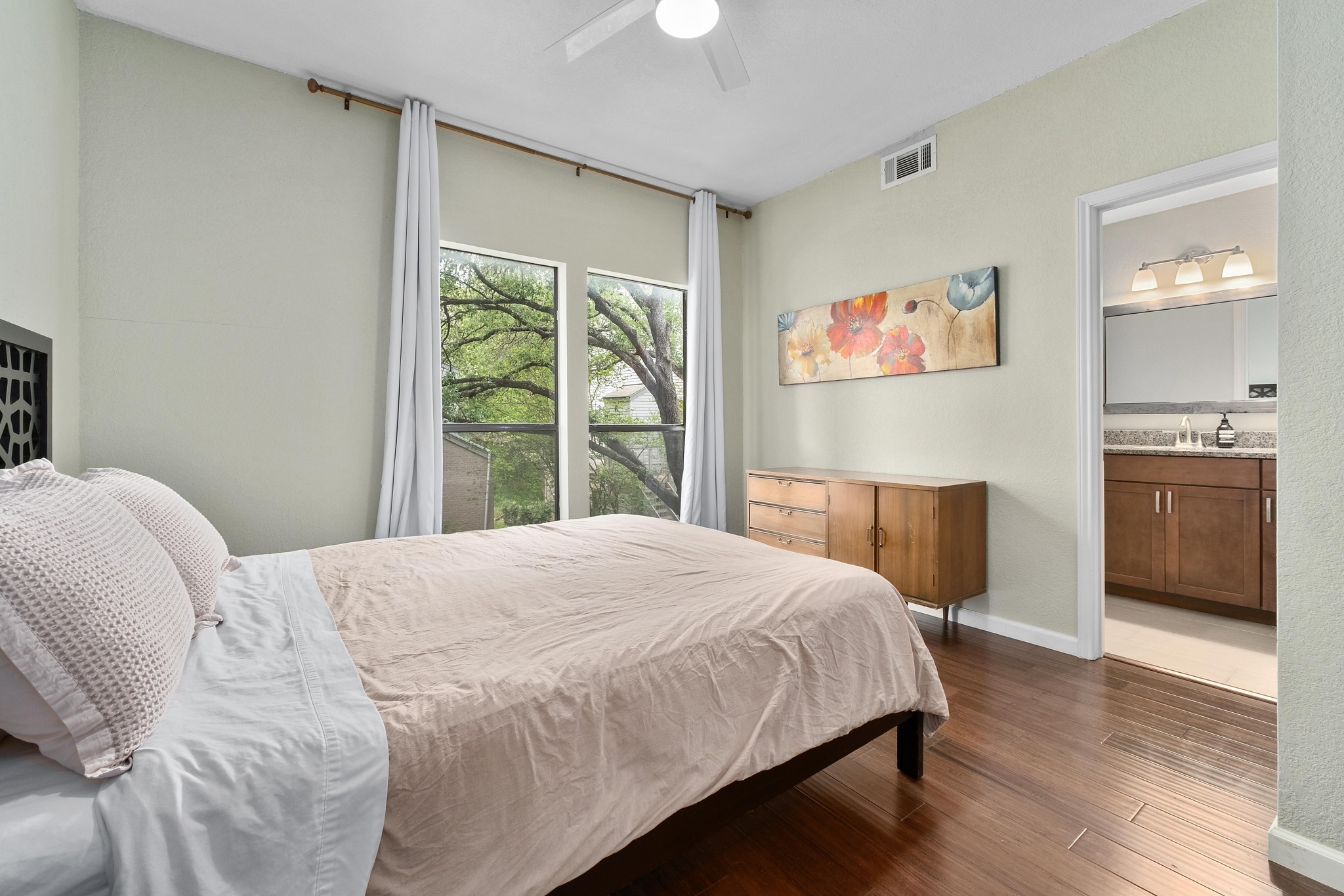 802 South 1st Street, Unit 115 Austin, TX 78704 - Photo 12 of 21 a bedroom with a bed and a window