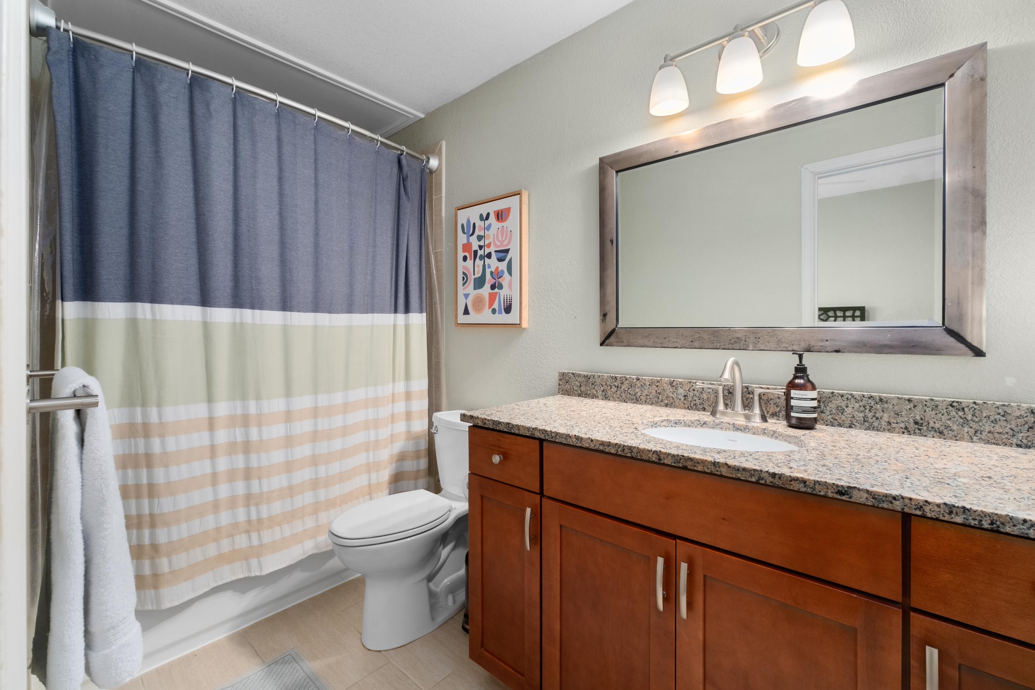 802 South 1st Street, Unit 115 Austin, TX 78704 - Photo 15 of 21 a bathroom with a granite countertop sink toilet and shower