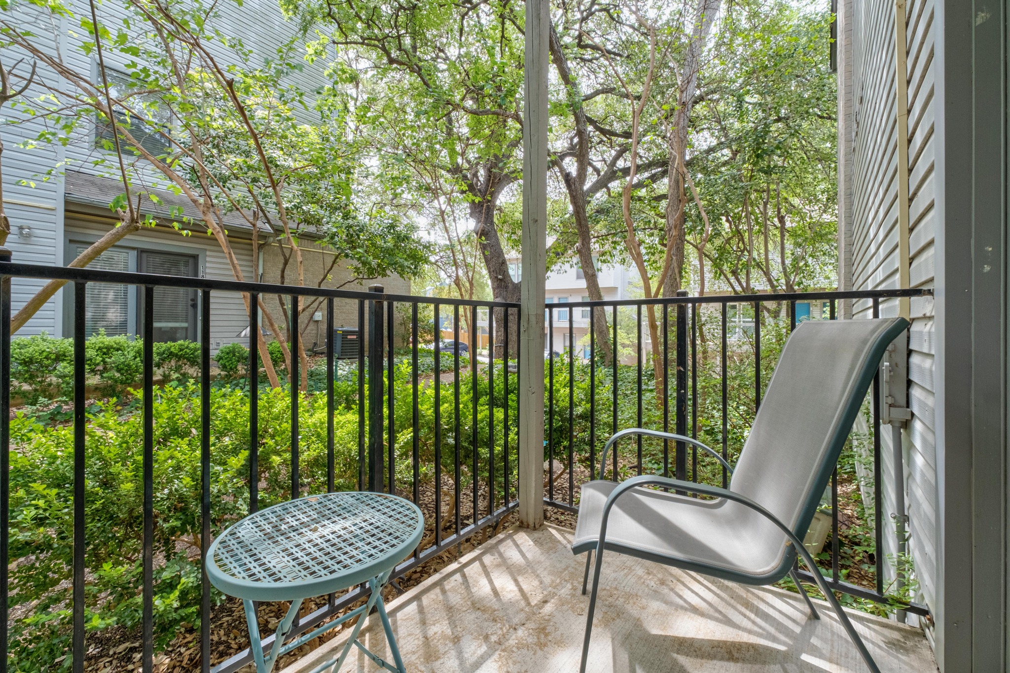 802 South 1st Street, Unit 115 Austin, TX 78704 - Photo 19 of 21 a view of a balcony with chair and table