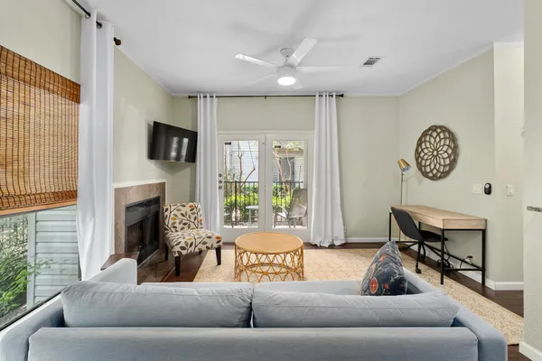 a living room with furniture and a fireplace