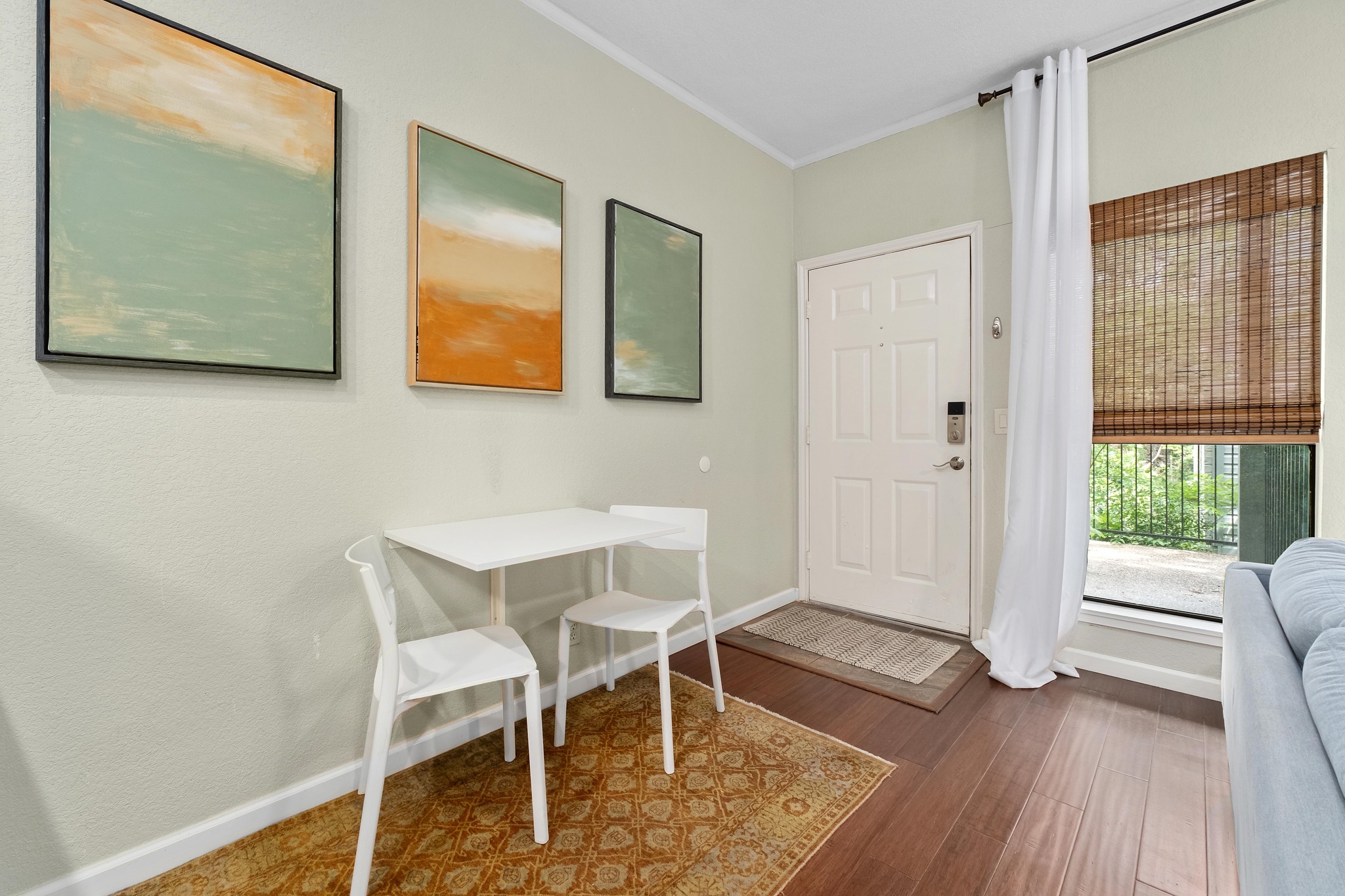 802 South 1st Street, Unit 115 Austin, TX 78704 - Photo 10 of 21 a view of a room that has a window and wooden floor