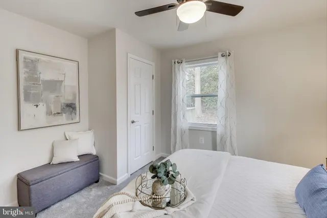 a bedroom with a bed and couch