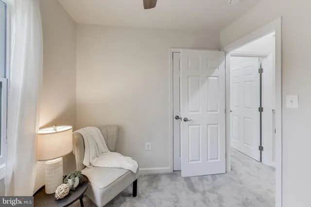 a bedroom with a bed and a chair