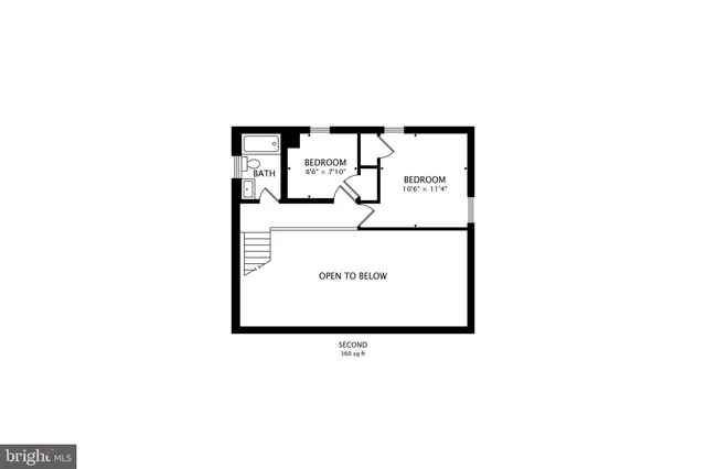 a picture of a bench in front of a wall