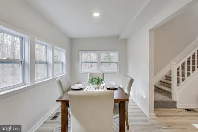a view of a room with furniture window and wooden floor