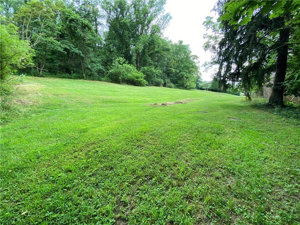 30 Momeyer Road Monongahela, PA 15063 - Photo 6 of 12 a view of a grassy field with trees in the background