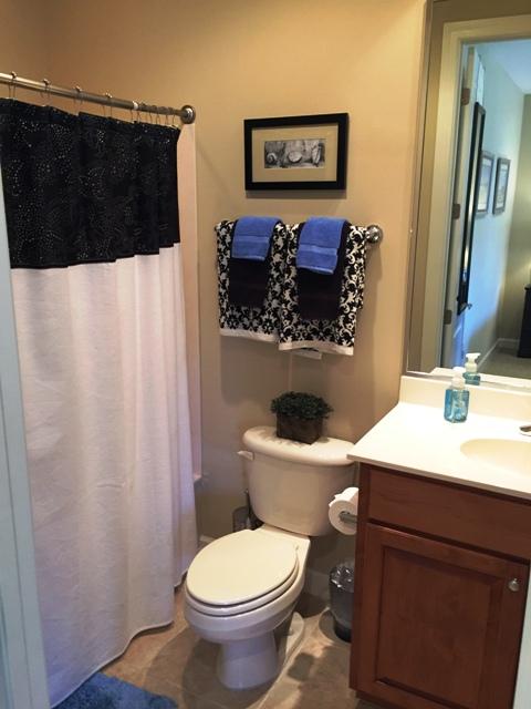 136 South Zander Way Santa Rosa Beach, FL 32459 - Photo 13 of 27 a bathroom with a sink toilet and mirror