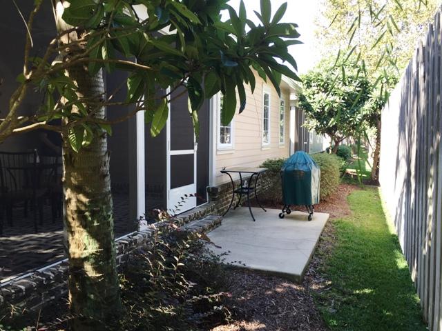 136 South Zander Way Santa Rosa Beach, FL 32459 - Photo 26 of 27 a view of backyard with a table and chair under an umbrella