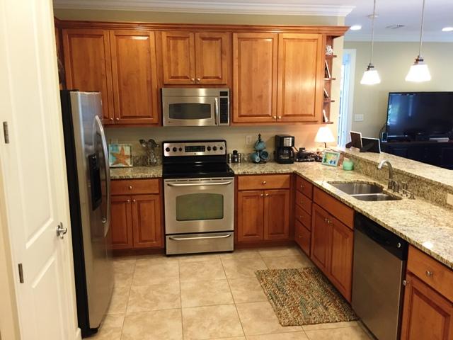 136 South Zander Way Santa Rosa Beach, FL 32459 - Photo 6 of 27 a kitchen with a sink stove and microwave