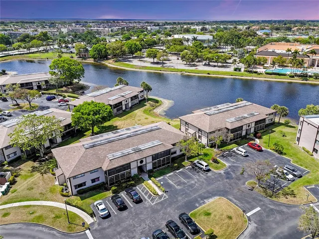 an aerial view of a house with yard swimming pool and outdoor seating