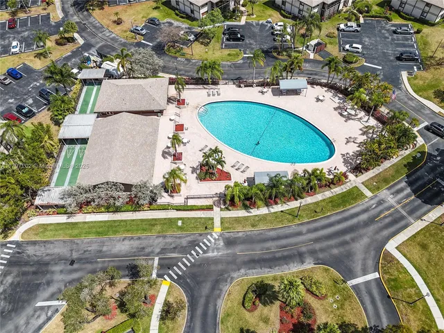 an aerial view of a house with a swimming pool