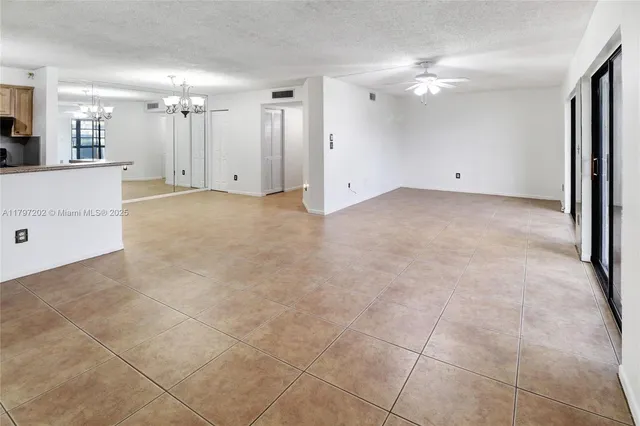 a view of a kitchen with cabinet and a bathroom