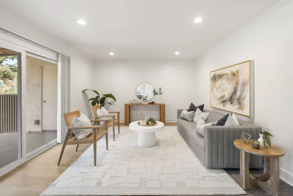a living room with furniture and a table