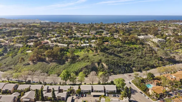 an aerial view of residential building with parking space