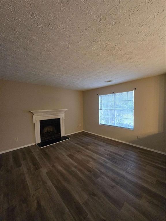 1717 Rondon Court Atlanta, GA 30316 - Photo 3 of 12 a view of an empty room with a fireplace and a window