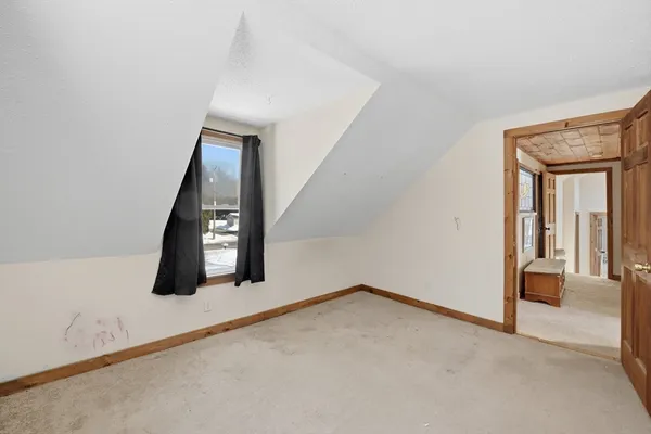 an entryway in a hall with a window