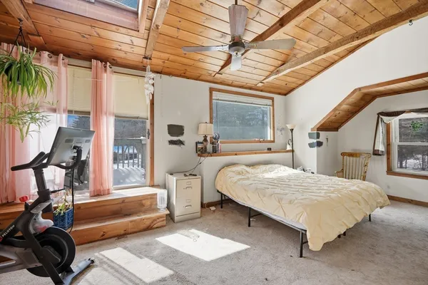 a bed room with a bed and a window