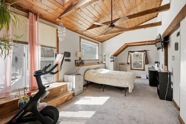 a bedroom with furniture and a window