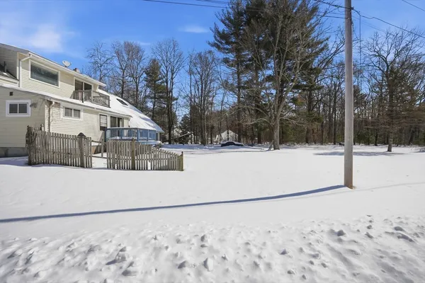 a view of a snow in the yard