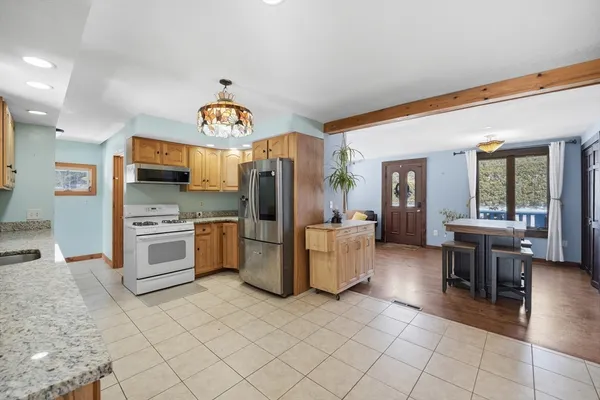 a kitchen with a sink cabinets and stainless steel appliances