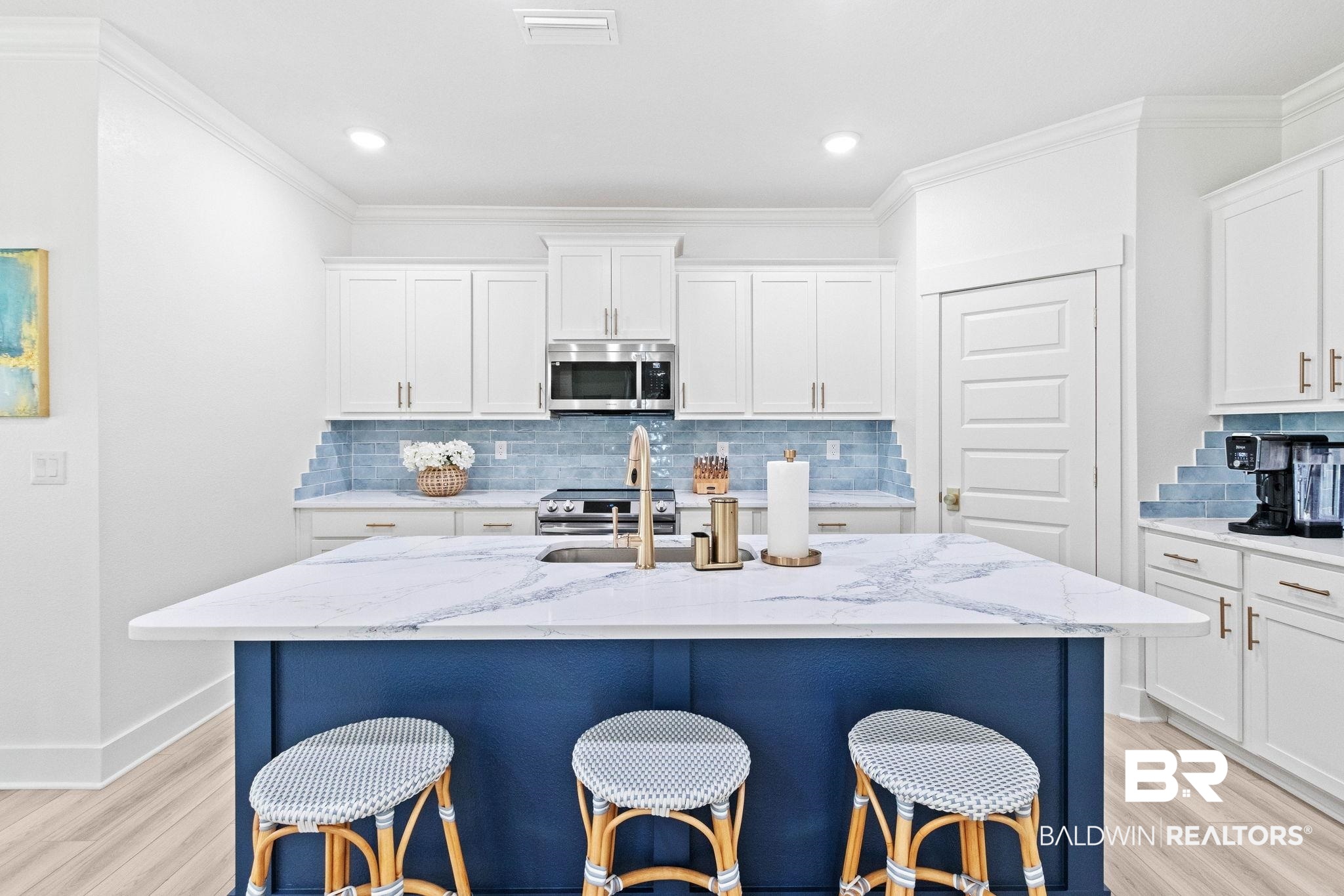 9815 Lakeview Drive Foley, AL 36535 - Photo 21 of 100 Kitchen with appliances with stainless steel finishes, light stone counters, and light hardwood / wood-style floors