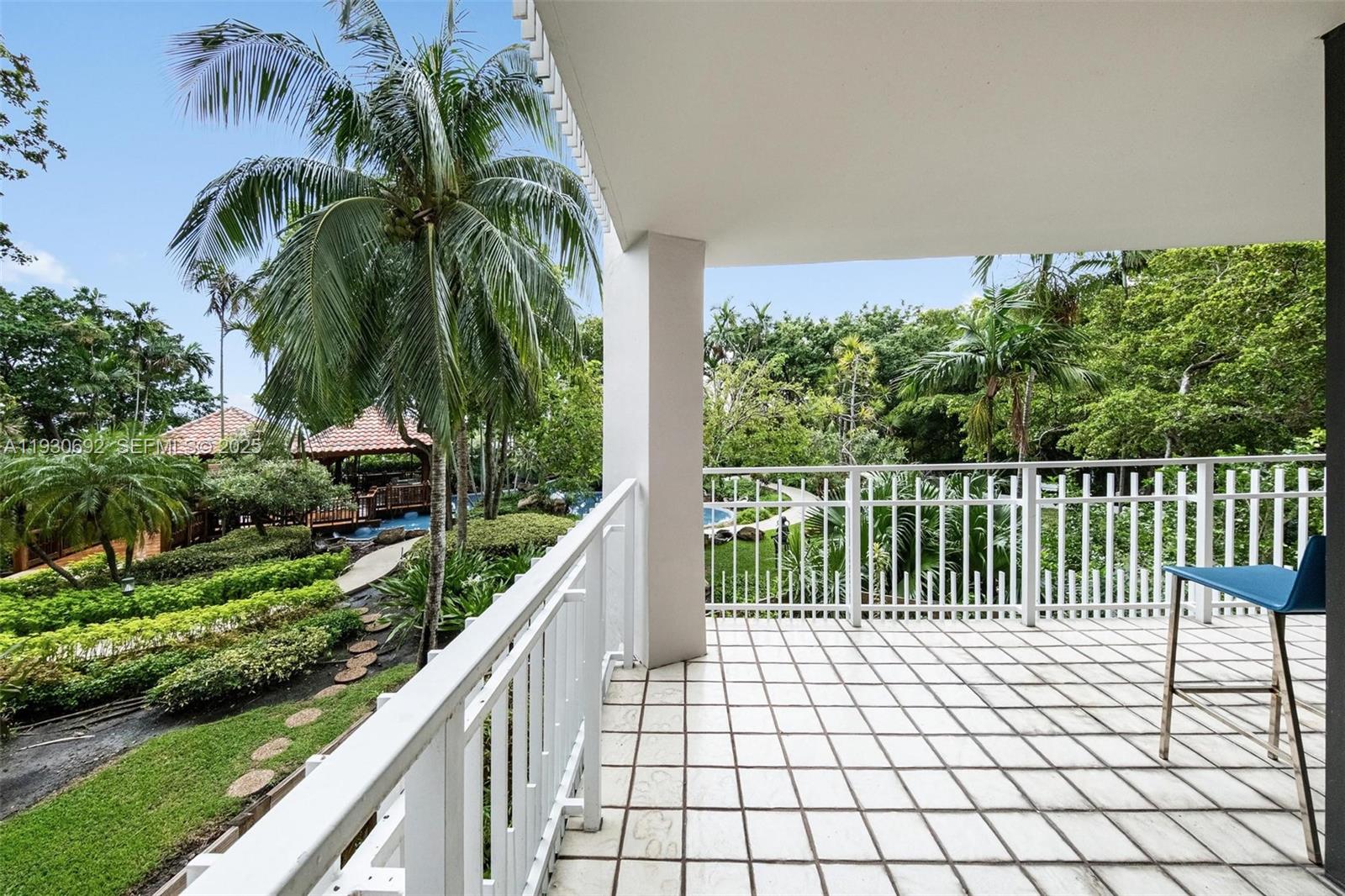 2000 Towerside Terrace, Unit 412 Miami, FL 33138 - Photo 17 of 57 a balcony with trees in front of it