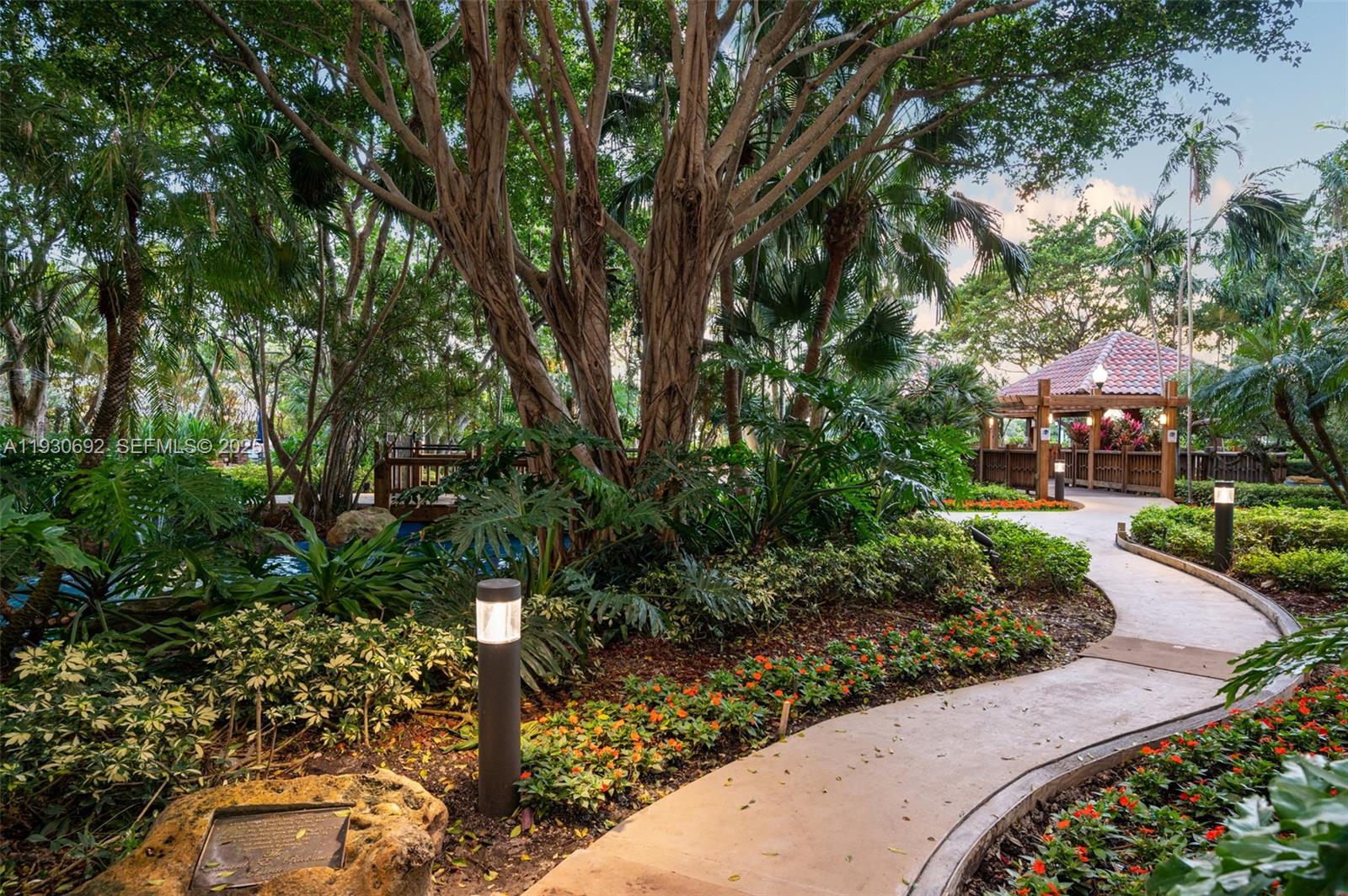2000 Towerside Terrace, Unit 412 Miami, FL 33138 - Photo 26 of 57 a view of a garden with pathway
