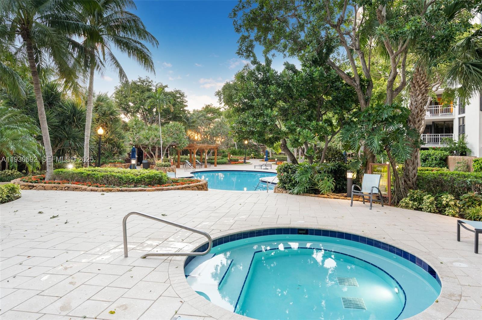 2000 Towerside Terrace, Unit 412 Miami, FL 33138 - Photo 30 of 57 a swimming pool with outdoor seating and yard