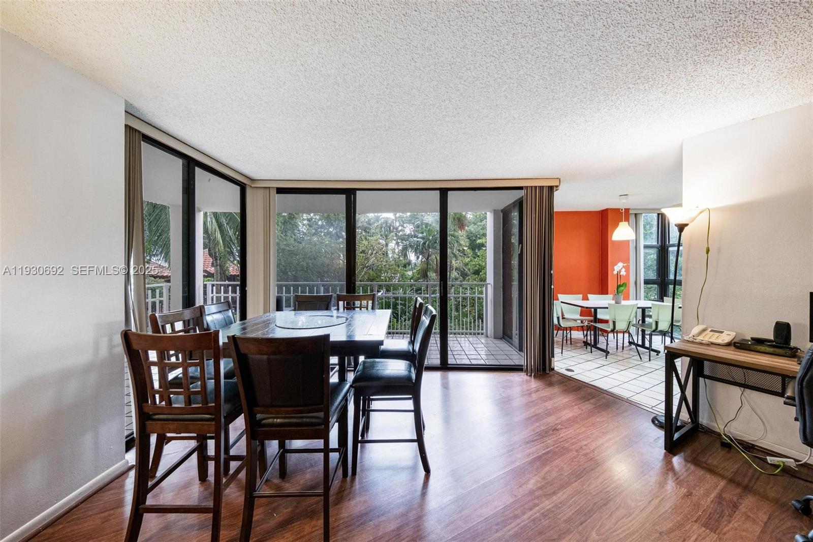 2000 Towerside Terrace, Unit 412 Miami, FL 33138 - Photo 3 of 57 a dining room with furniture window and wooden floor