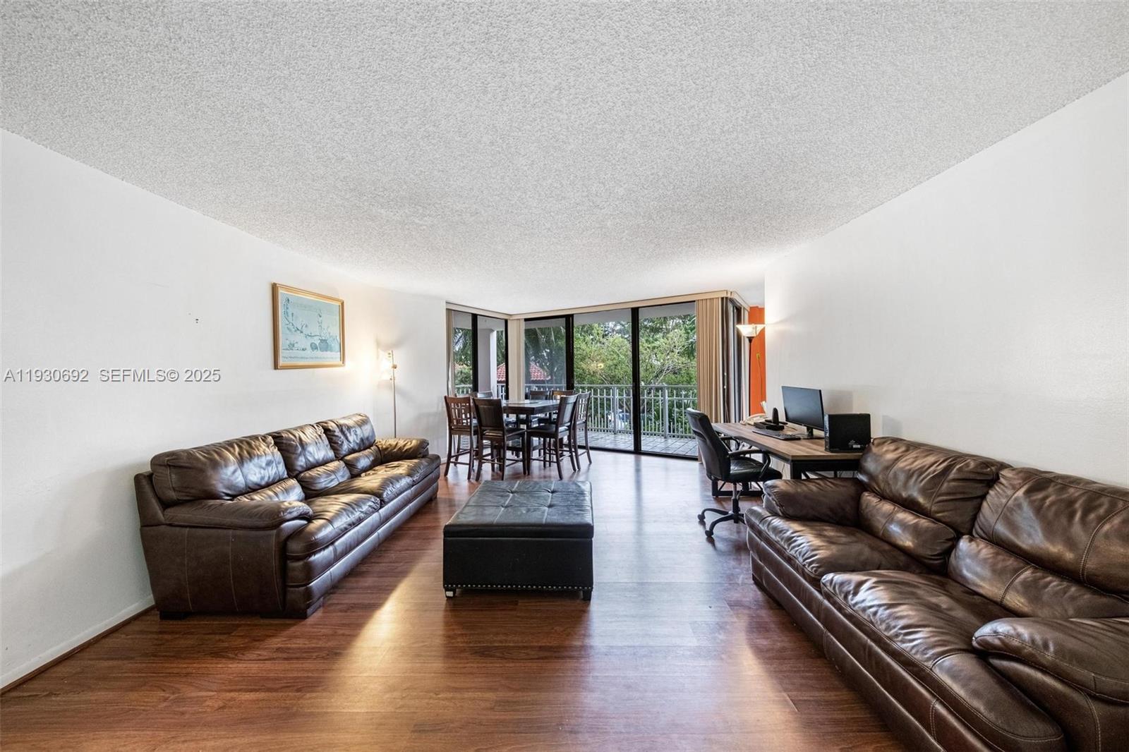 2000 Towerside Terrace, Unit 412 Miami, FL 33138 - Photo 4 of 57 a living room with furniture and a large window