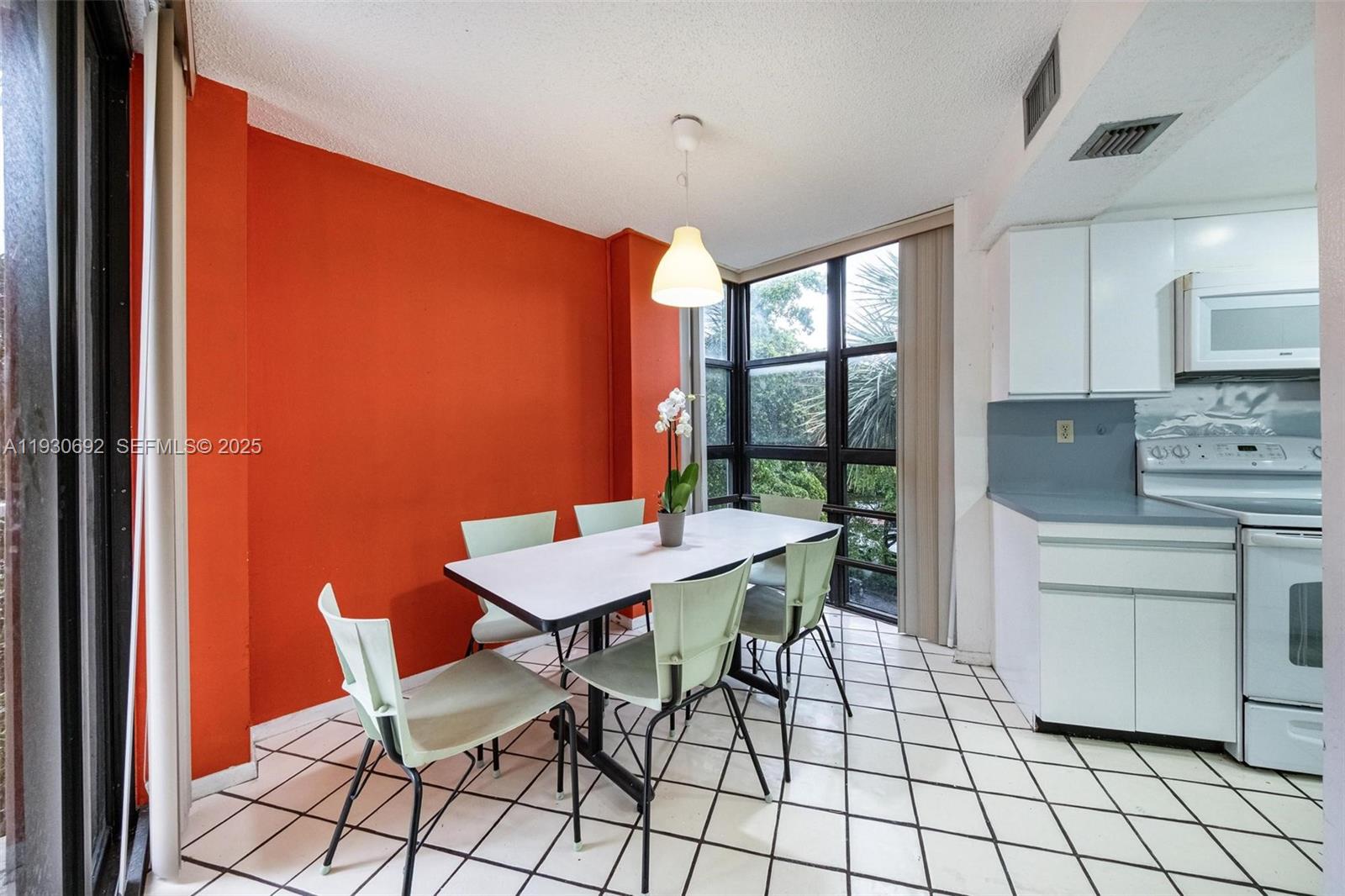 2000 Towerside Terrace, Unit 412 Miami, FL 33138 - Photo 6 of 57 a view of a dining room with furniture window and outside view