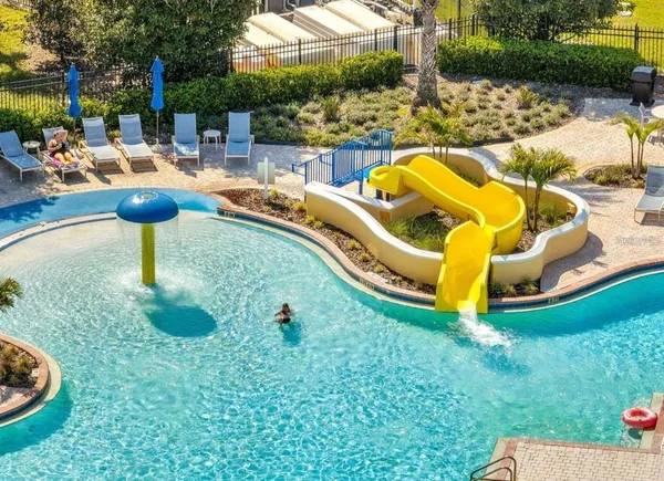 a swimming pool with outdoor seating and yard