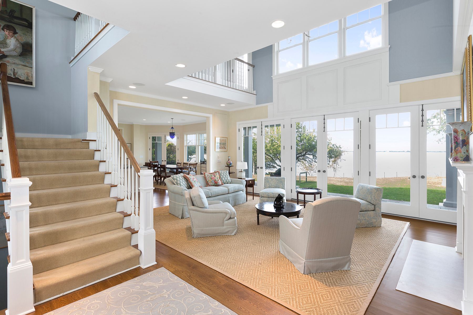 182 Springy Banks Road East Hampton, NY 11937 - Photo 12 of 12 a living room with furniture large windows and wooden floor