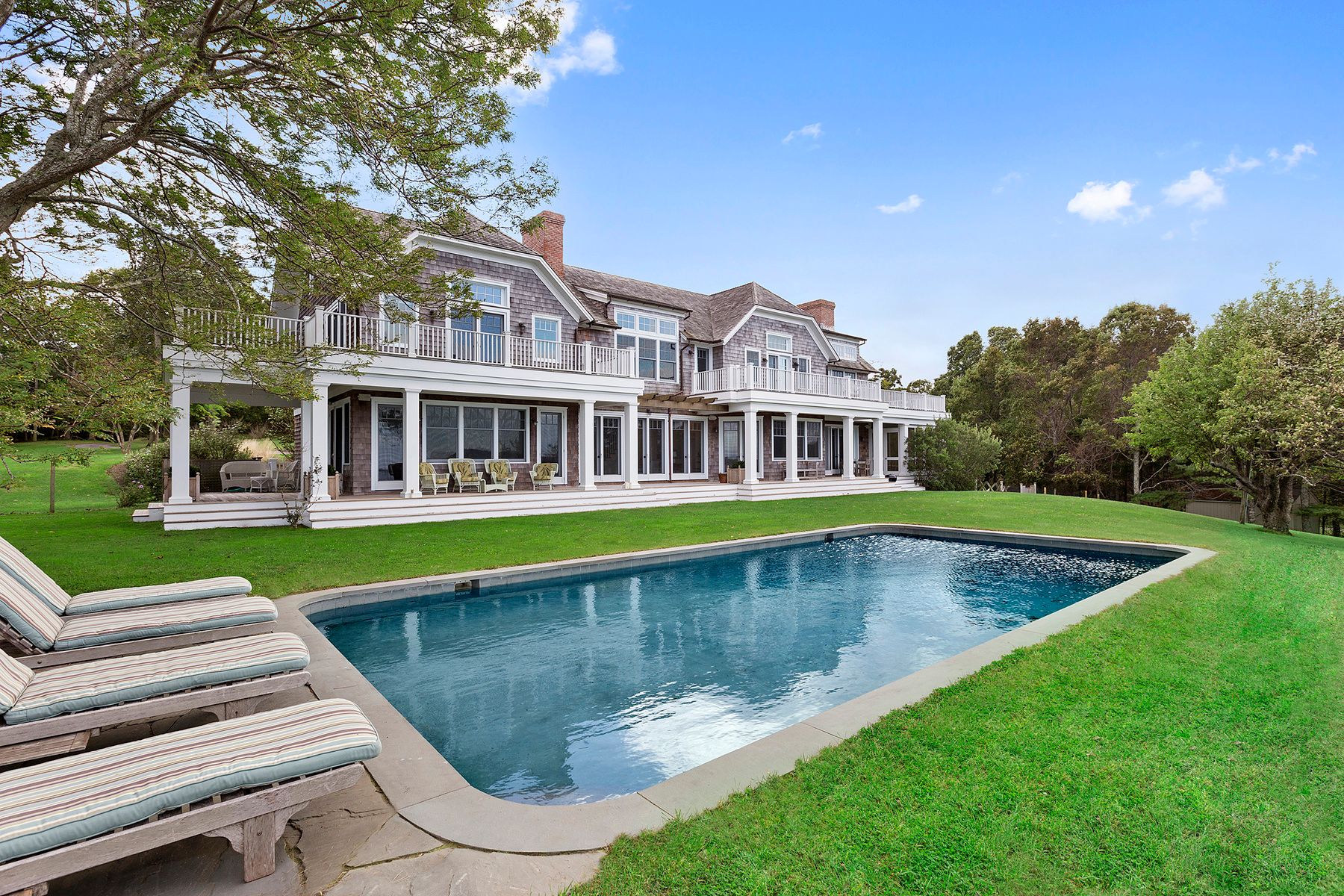 182 Springy Banks Road East Hampton, NY 11937 - Photo 3 of 12 a view of a house with swimming pool and a yard