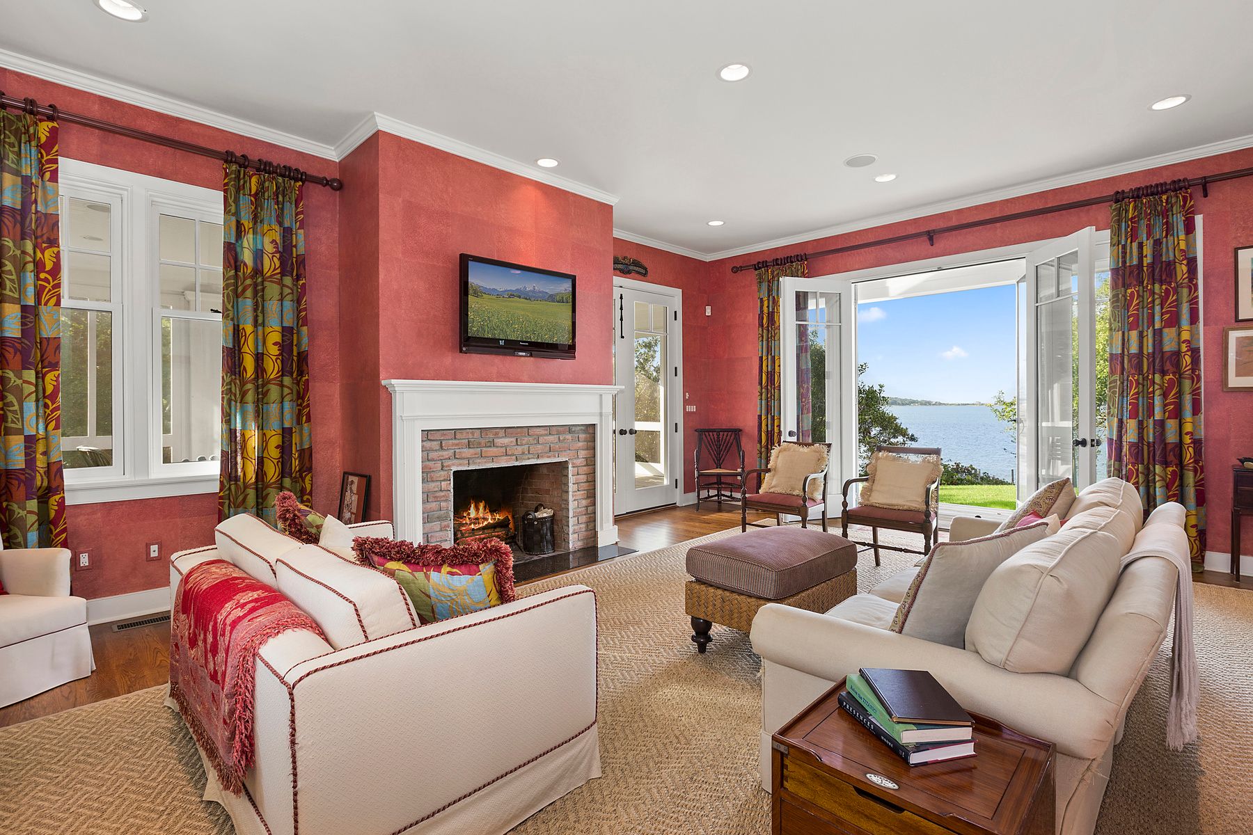 182 Springy Banks Road East Hampton, NY 11937 - Photo 10 of 12 a living room with furniture a large window and a fireplace