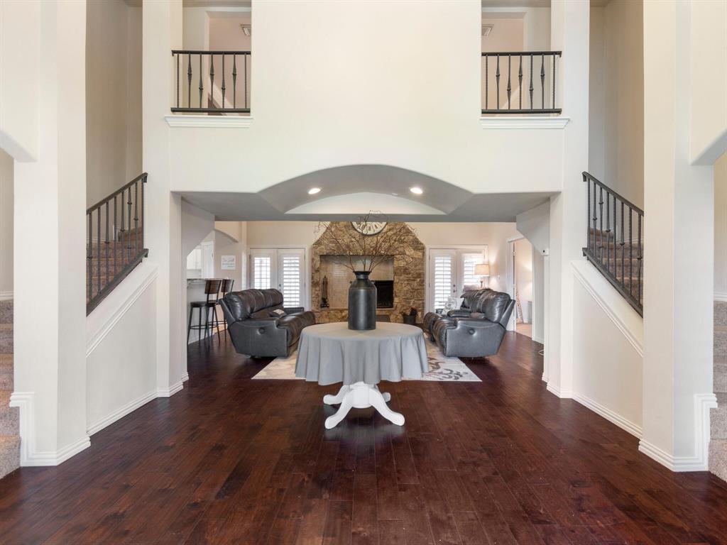 3313 Country Club Road Pantego, TX 76013 - Photo 1 of 1 a living room with furniture and a chandelier