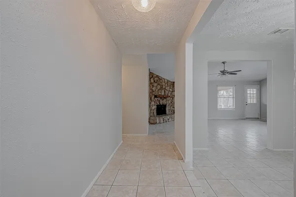 wooden floor in a hall with a bathroom