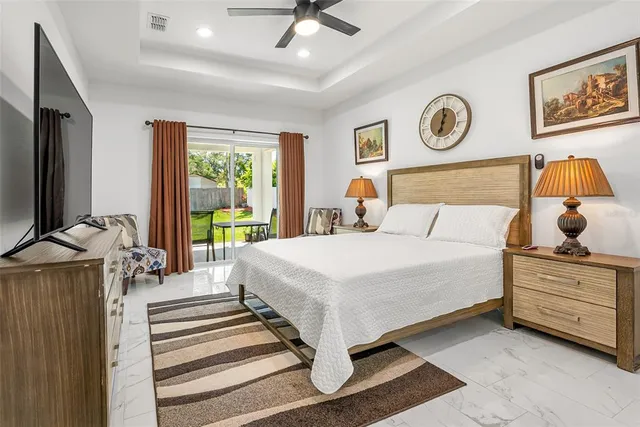 an aerial view of a house with yard swimming pool and outdoor seating