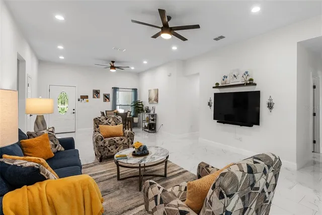 a living room with furniture and a window