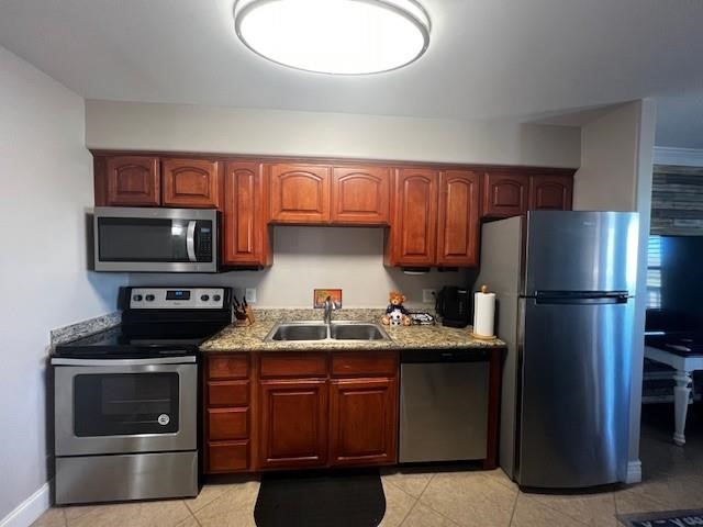 2290 North Fulton Beach Road, Unit B317 Rockport, TX 78382 - Photo 11 of 40 a kitchen with a sink a microwave a refrigerator and cabinets