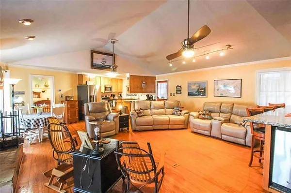 a living room with lots of furniture and white walls