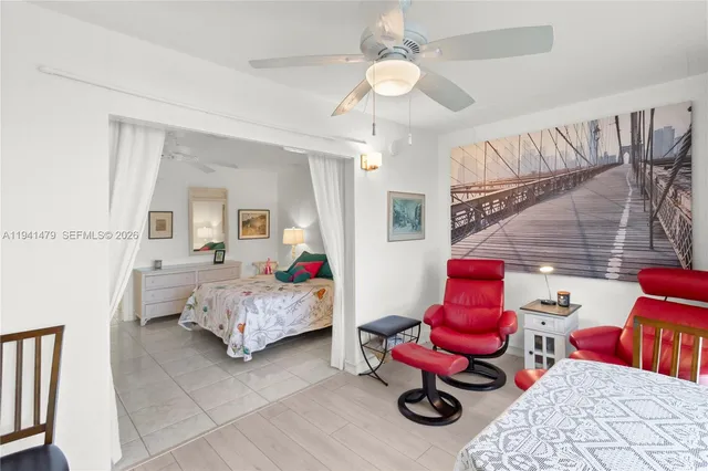 a bedroom with furniture and a chandelier